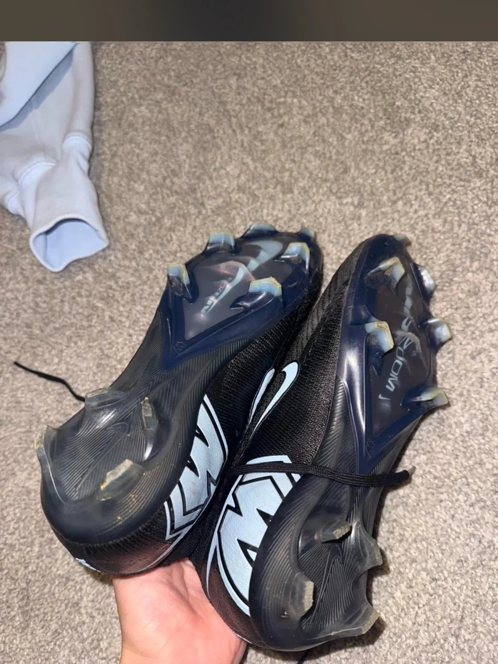 Nike woman’s Gen 4 black and light blue soccer cleats size 6